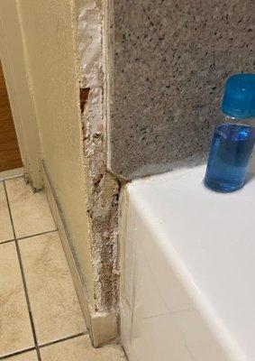 busted up walls in bathroom