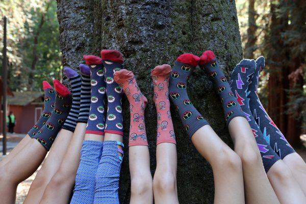 Camp Erin Santa Cruz & some of the socks donated by SockShop & Shoe Company to campers each year. Love our community support :)