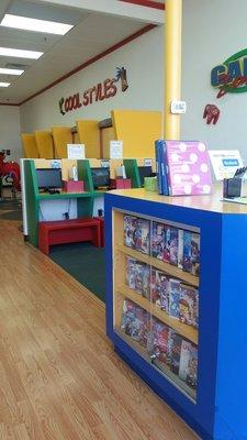 Movie selection for kids while they get a cut. Games in the waiting area too...