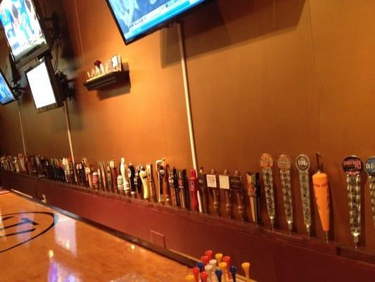 Retired and semi-retired taps on display behind the bar.