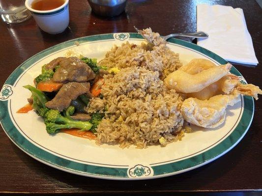 Dinner meal with broccoli beef and pork fired rice and fried shrimp