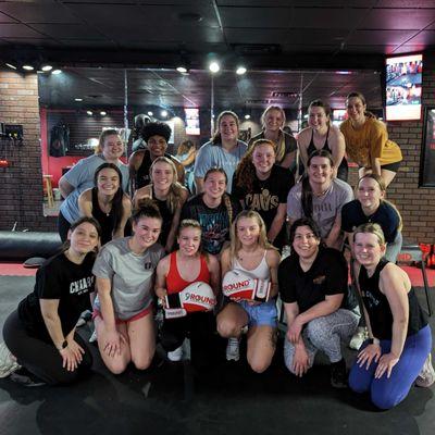 A happy group of girls from University of Akron's Chaarg pose after their killer workout at 9ROUND Kickboxing Fitness in Fairlawn