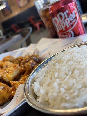 Honey garlic boneless wings a side of steam rice and a refreshing Dr Pepper