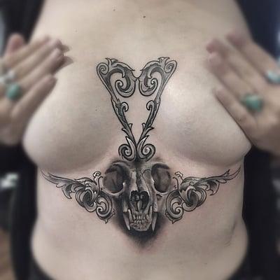 Skull and filigree tattoo by Bror