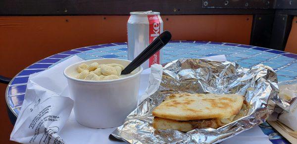 Cup of chicken velvet with crackers, half Dirty Swede panini