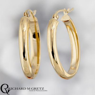 14kt yellow gold hoop earrings.