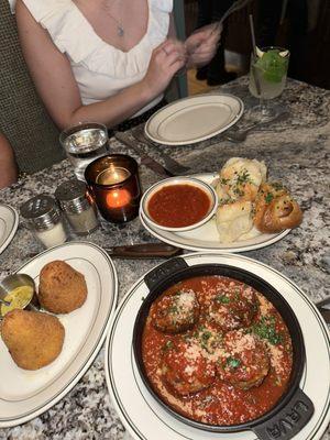 Meatballs, arancini, garlic knots