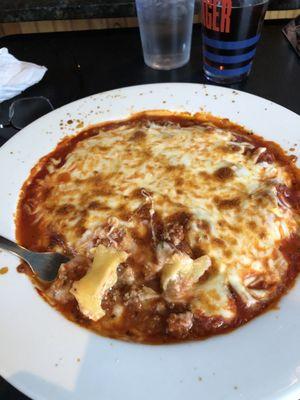 Ravioli special, smothered in meat sauce and mozzarella. Hot and gooey. Small Caesar salad, but no garlic bread.