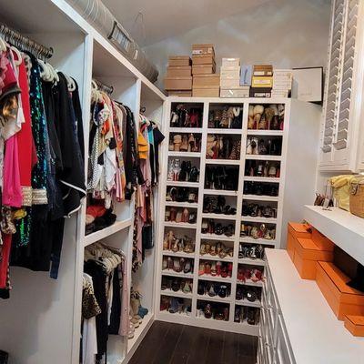 Custom Master Closet with custom Cabinetry and shoe rack