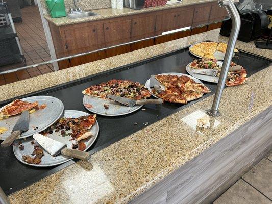 The pizza selection and someone's used napkin.