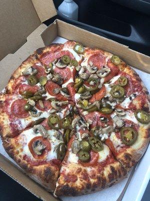 Medium pepperoni, mushrooms and jalapeño pizza.