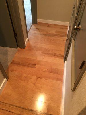 Wood Flooring, Baseboards, and carpet installed by Flooring and More.