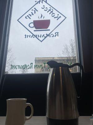 Front window with an order of coffee. Yes, coffee comes in a carafe so you can serve yourself hot coffee.