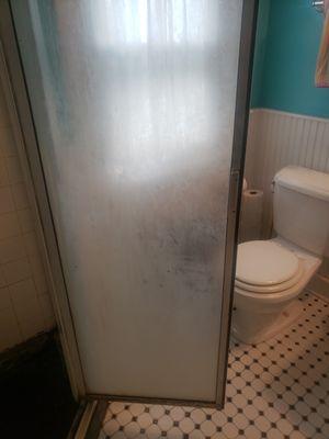 Soap scum build up on shower door