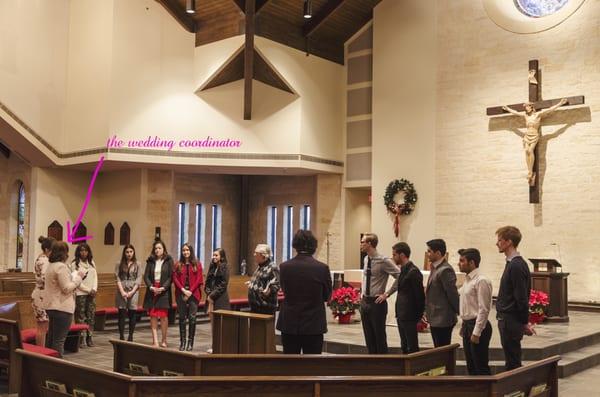 Miranda speaking to the wedding party at the rehearsal