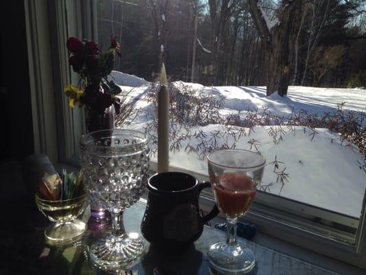 Enjoying a crisp winter morning from the dining room, while drinking the Buttonwood speciality "Mount Surprise Sunrise"