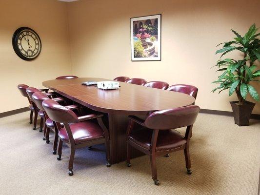 Shared 12-seat conference room.