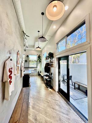 Corridor between table side patio, register, and restroom