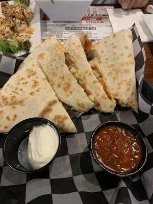 The loaded quesadillas are excellent and come with peppers, onions and mushrooms. I highly recommend them