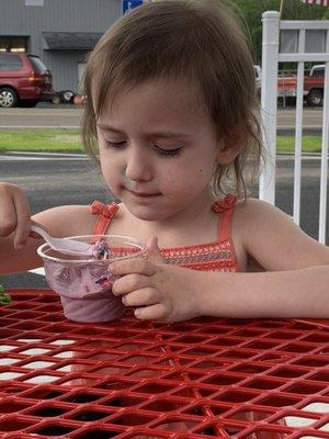 Our three year old enjoying "purple" ice cream w rainbow sprinkles