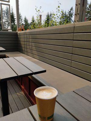 Lovely outdoor seating amongst floral greenery