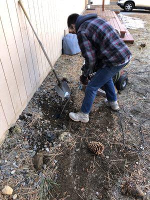 Terry clearing some roots from our lateral.