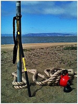 On the beach at 6am doing kettle bells, TRX, Heavy ropes!