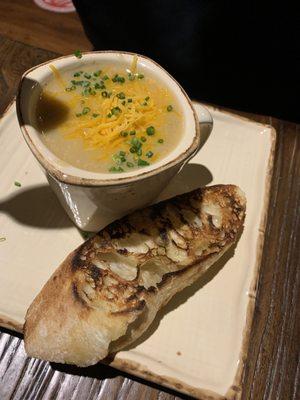 Cheesy potato soup with grilled baguette