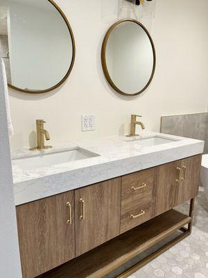 Bathroom remodel with gold fixtures