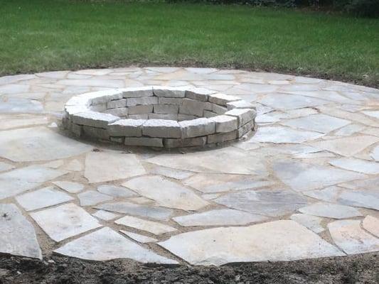 Patio with a wood fire pit