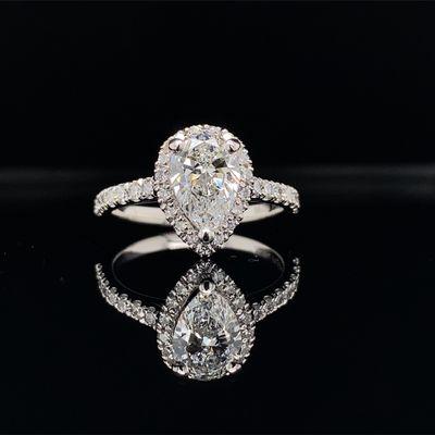 Pear shape diamond with halo or round diamonds platinum engagement ring