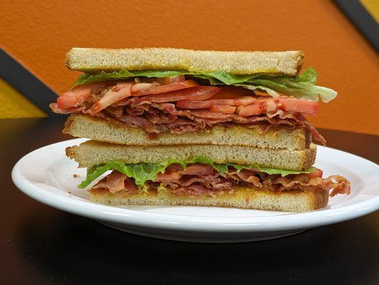 BLT Sandwich, Made with 8 strips of bacon, fresh tomato, and crispy lettuce on toasted bread.