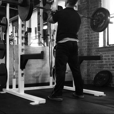 Front Squats to strengthen every muscle in the legs, as well as build strong abdominal muscle