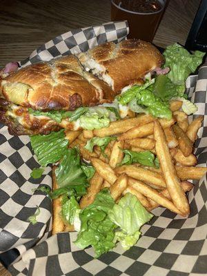 The Herbivore Grinder (artichoke hearts, mushrooms, caramelized onions, pesto, romaine & mozzarella on French bread). Excellent!