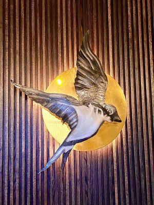 Their logo bird as wall art in their tasting room