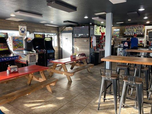 The inside seating area with arcade games