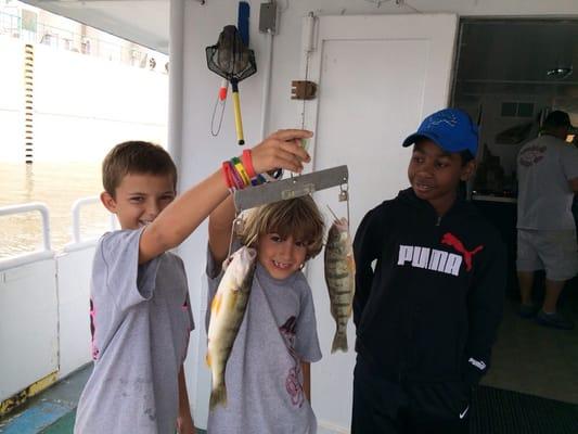 Kids weighing the catch