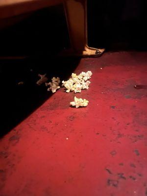 Spilled popcorn everywhere