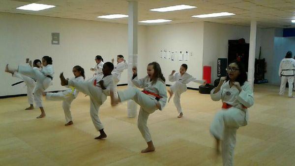 Kids class kicking practice