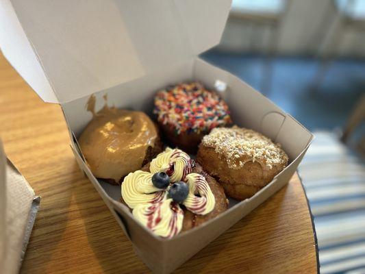 Clockwise-  Maple, sprinkle, salted caramel, and lemon blueberry.