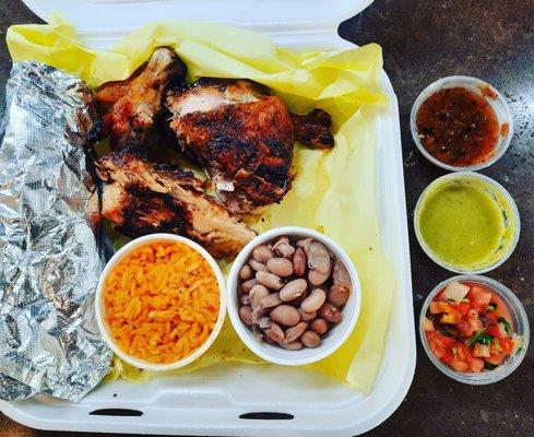 Half chicken with salsa and sides.