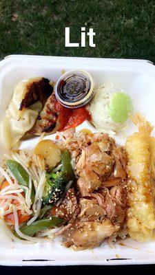 Combination plate with rice and veggies, tempera shrimp,dumplings and potato salad