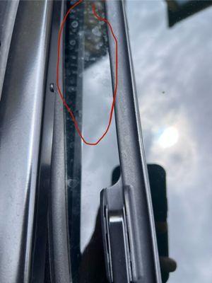 Water spots right in between of windshield wipers.