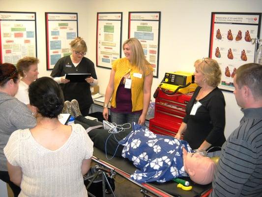 Our instructor, Sherri with a group of ACLS (Advanced Cardiovascular Life Support) students, during the megacode.