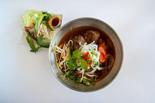 Slow cooked braised beef in vegetable stew served with clear glass noodle or egg noodle.