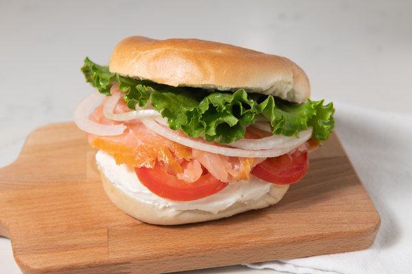 Salmon Bagel. Smoked salmon, cream cheese, tomatoes, onions, & topped off with lettuce. A customer favorite.