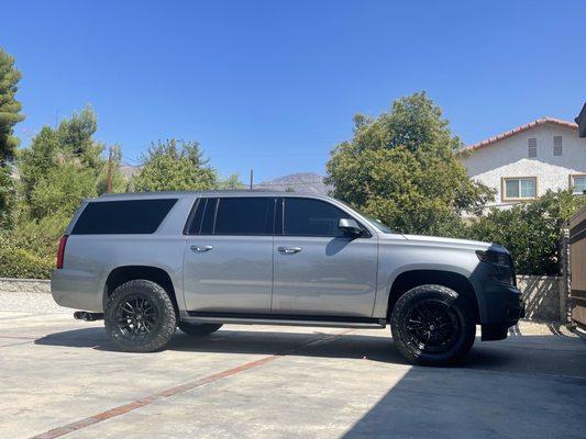 18 Suburban with Fuel wheels and Toyo tires with a 2 1/2 lift. This came out super clean and the wife loves it!