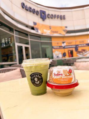 Iced Matcha Latte with Vanilla Syrup and Hummus with Pretzels.