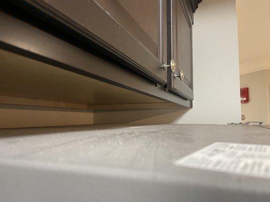 Dirt/dust above the fridge.