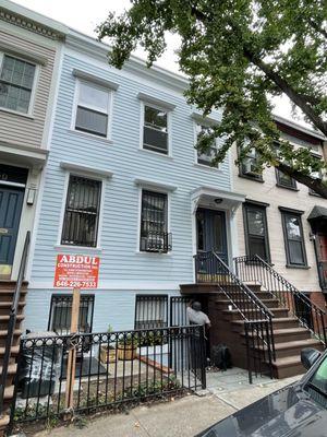 Brownstone steps, brand new siding, painted the entire house, and repaired cornice.